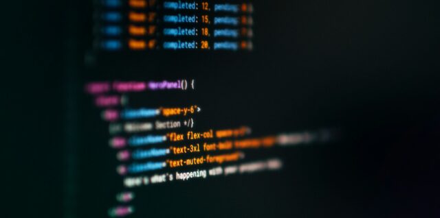 Computer screen displaying colorful code snippets